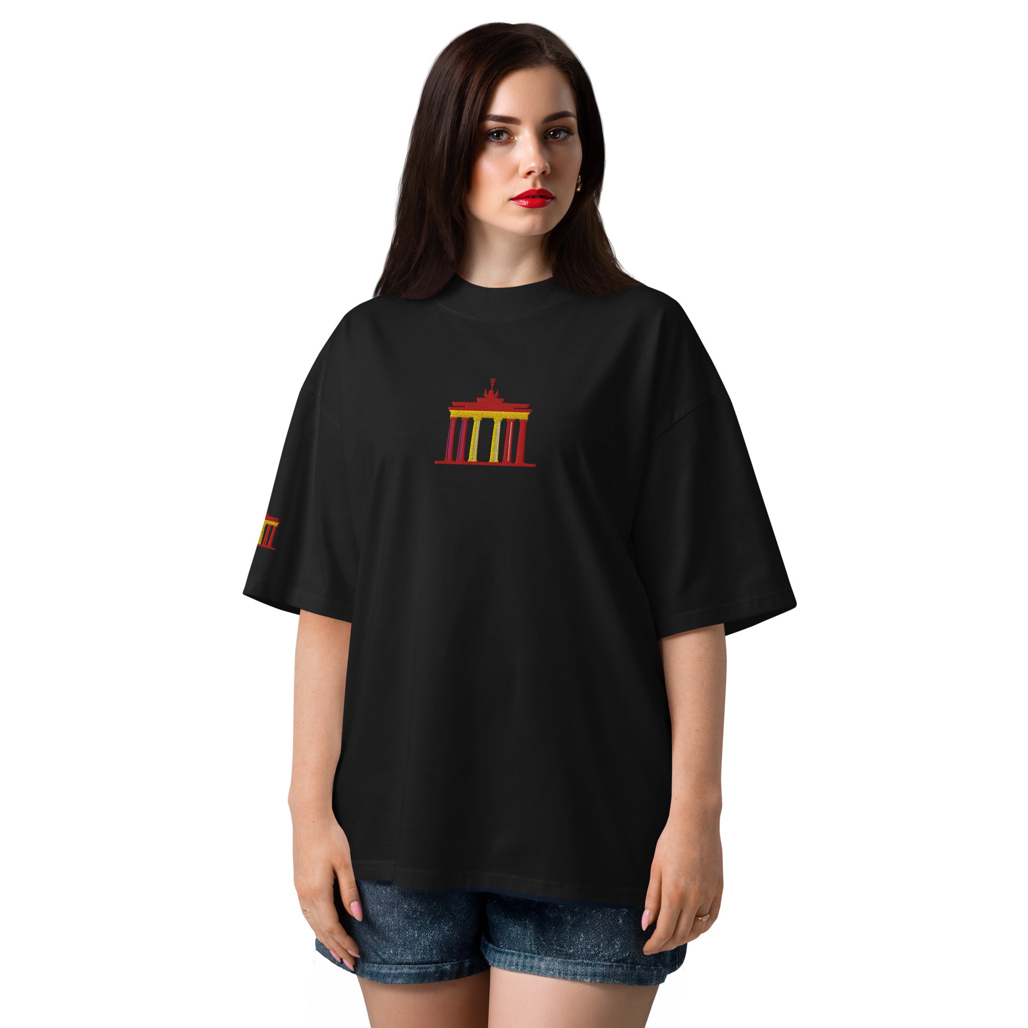 Woman wearing a black t-shirt with a colorful graphic on a white background