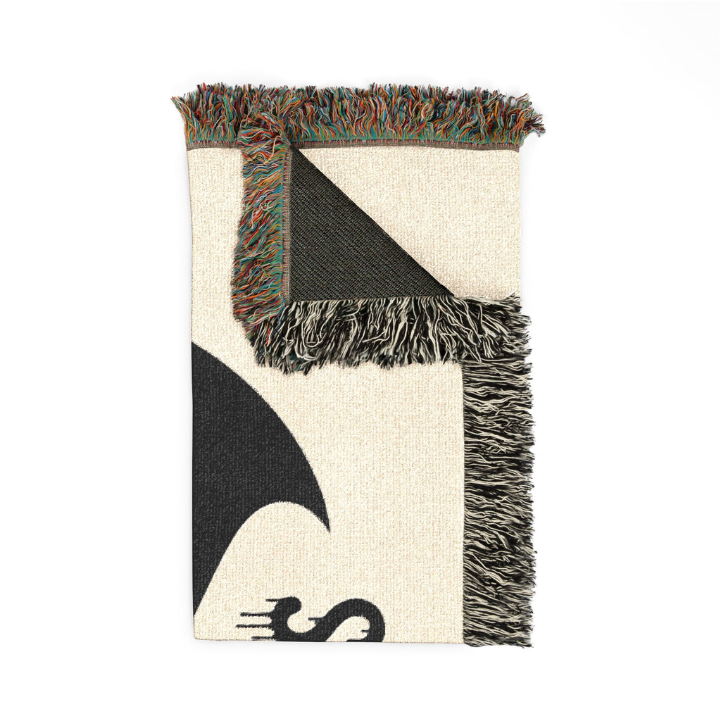 Textile with geometric pattern and fringe on a white background