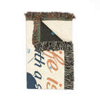 Textile with fringe edge and printed text on a white background