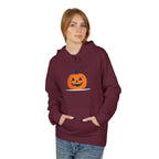 Person wearing a maroon hoodie with a pumpkin design on a white background