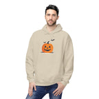 Man wearing a beige hoodie with a Halloween pumpkin design on a white background