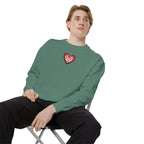 Person wearing a teal long-sleeve shirt sitting on a chair against a white background
