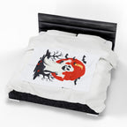 White duvet with black and red design on a bed with a white background