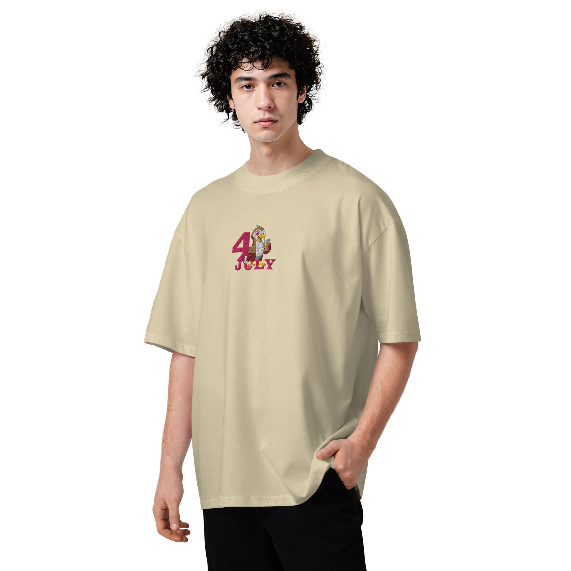 Person wearing a beige t-shirt with a graphic design on a white background