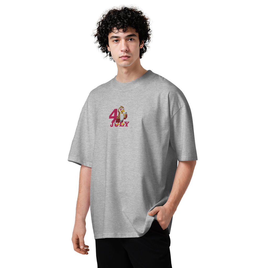 Person wearing a gray t-shirt with a colorful graphic design on a white background