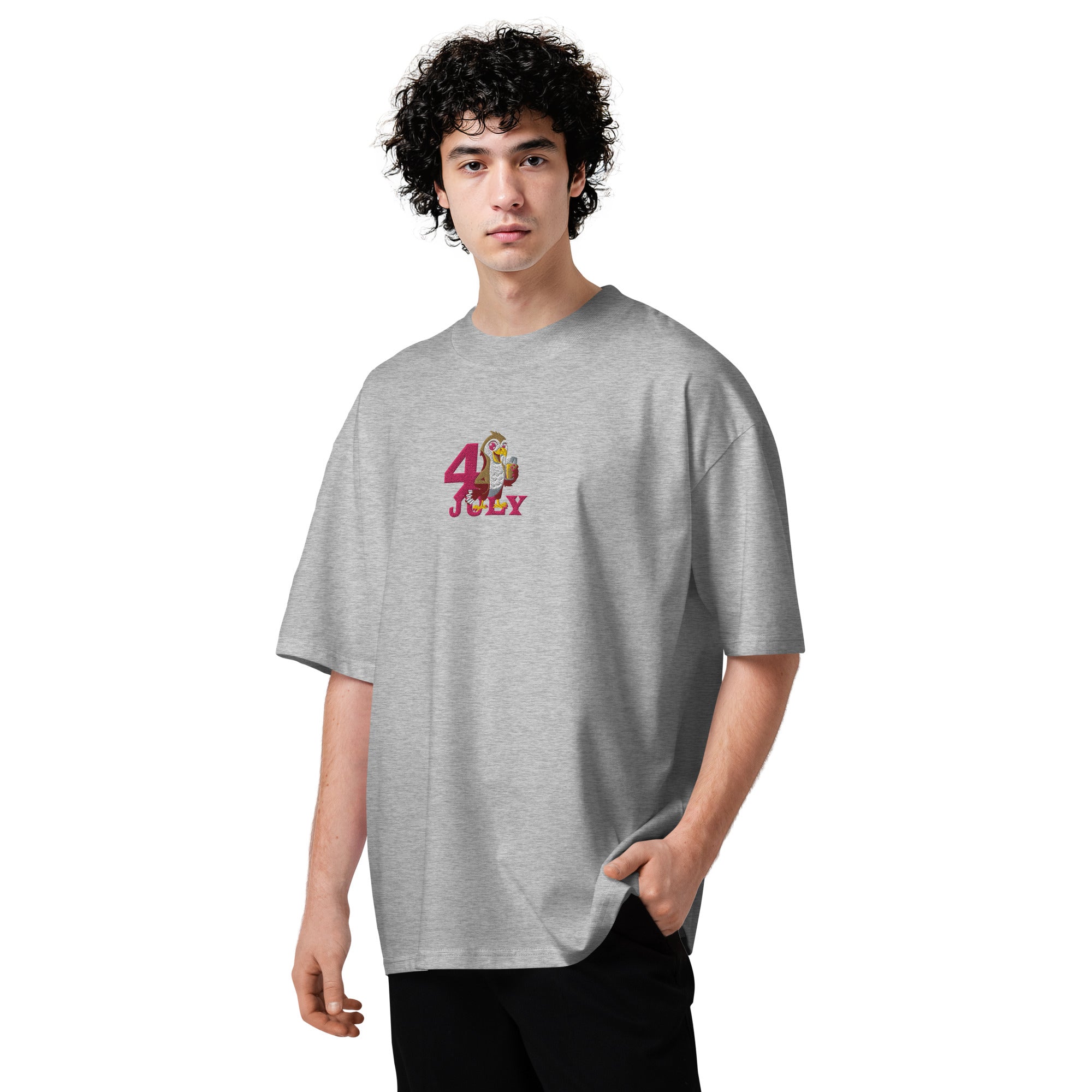Person wearing a gray t-shirt with a colorful graphic design on a white background