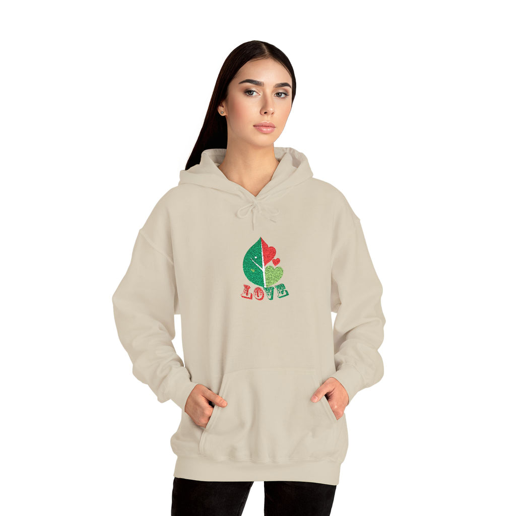 Woman wearing a beige hoodie with a colorful design on a white background