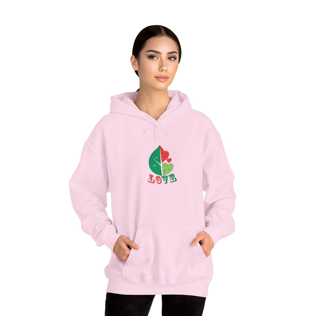 Woman wearing a pink hoodie with a colorful design on a white background