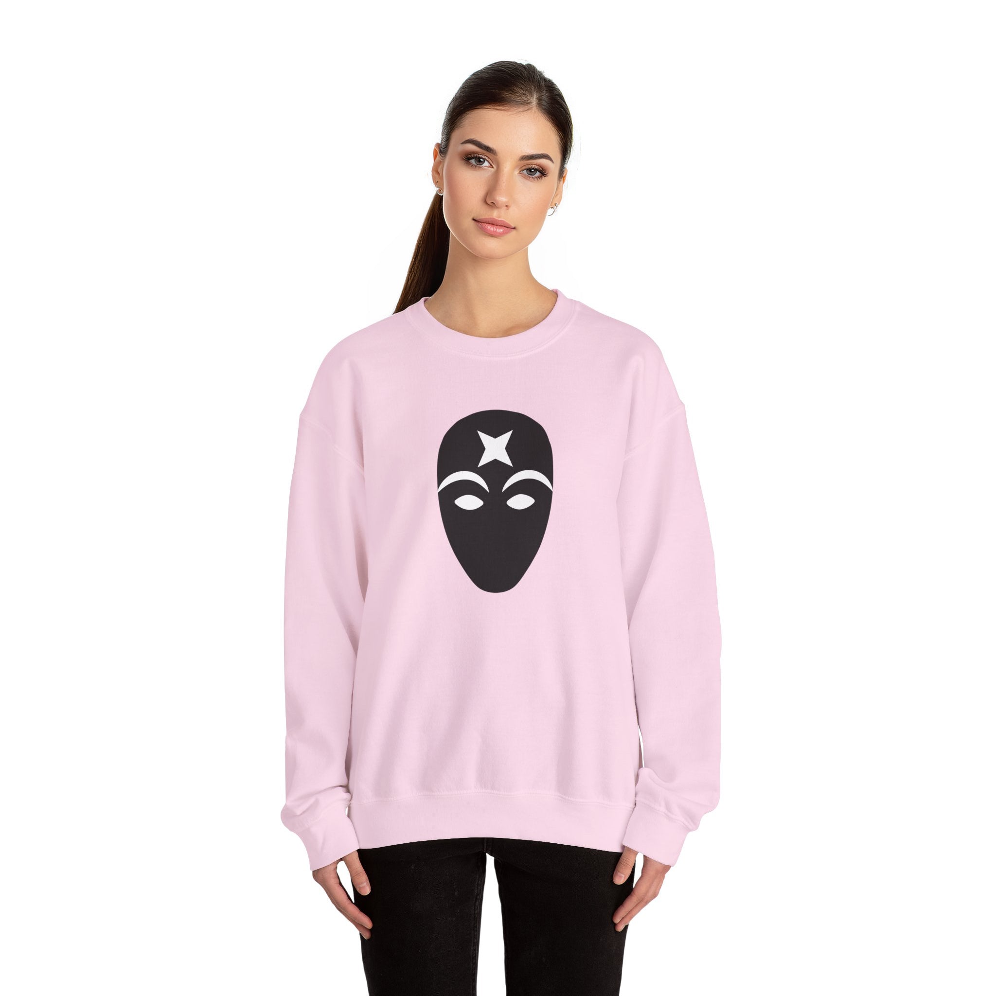 Woman wearing a pink sweatshirt with a black mask design on a white background