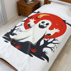 Ghost design on a bedspread with a red moon in a bedroom setting