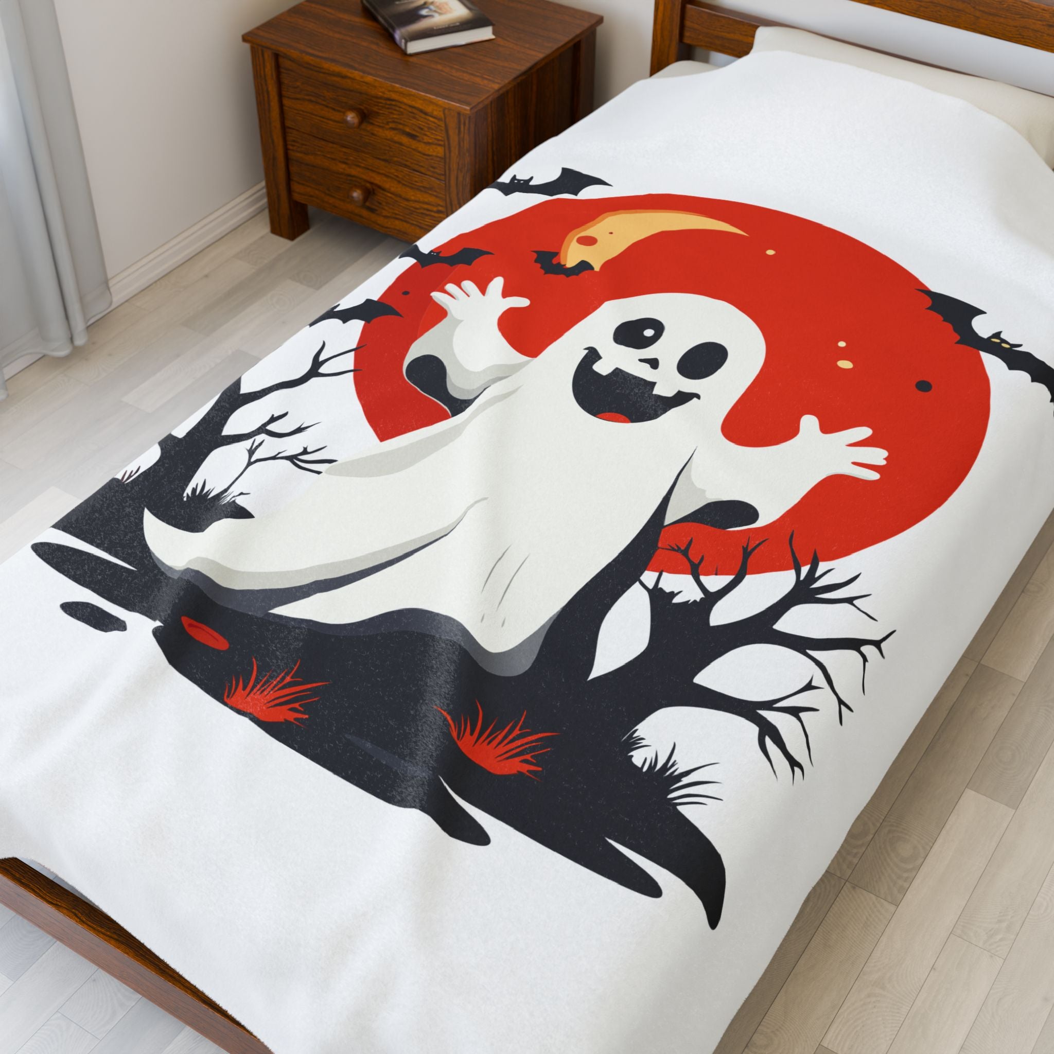 Ghost design on a bedspread with a red moon in a bedroom setting