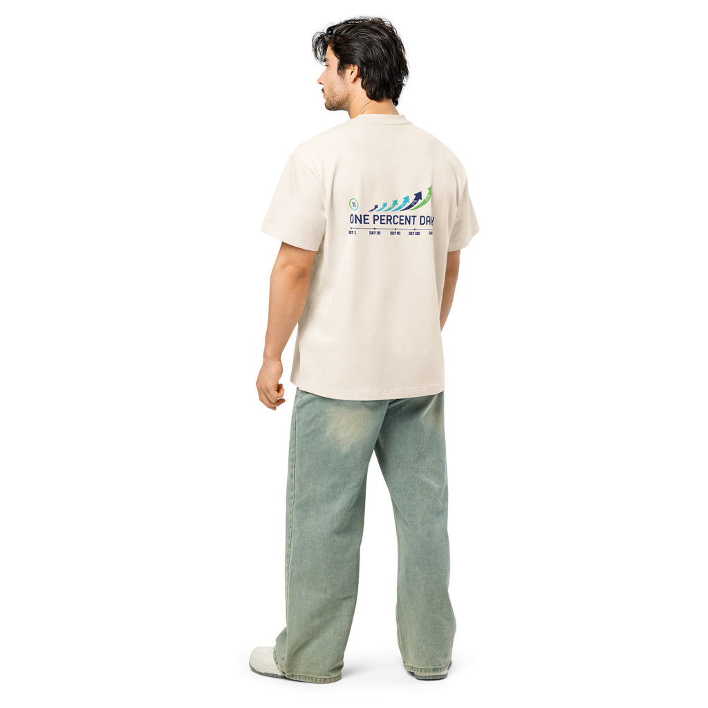 Man wearing a beige t-shirt with a logo on the back, standing against a white background