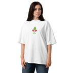 Woman wearing a white t-shirt with a green leaf design on a white background