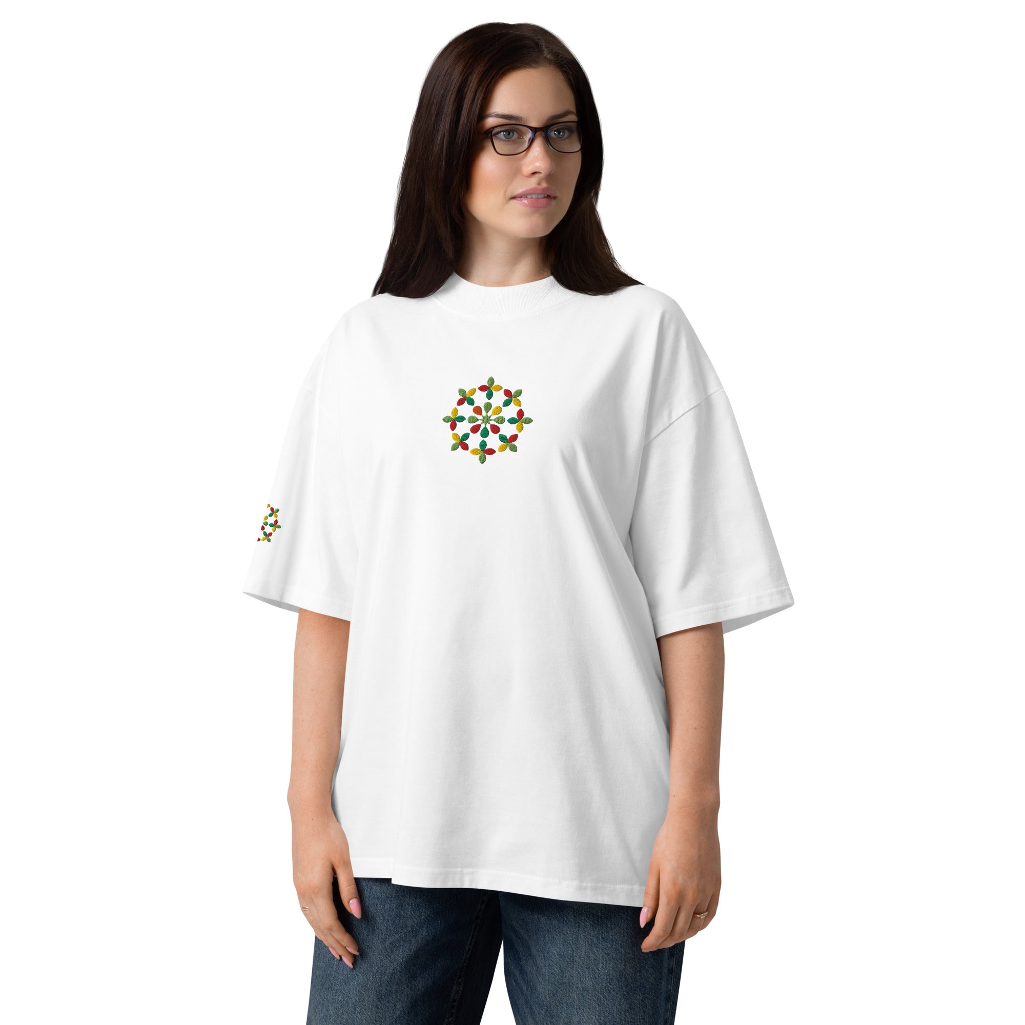 Woman wearing a white t-shirt with a colorful design on a white background