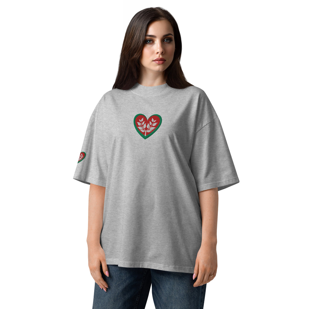 Woman wearing a gray t-shirt with a heart design on a white background