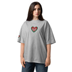 Woman wearing a gray t-shirt with a heart design on a white background