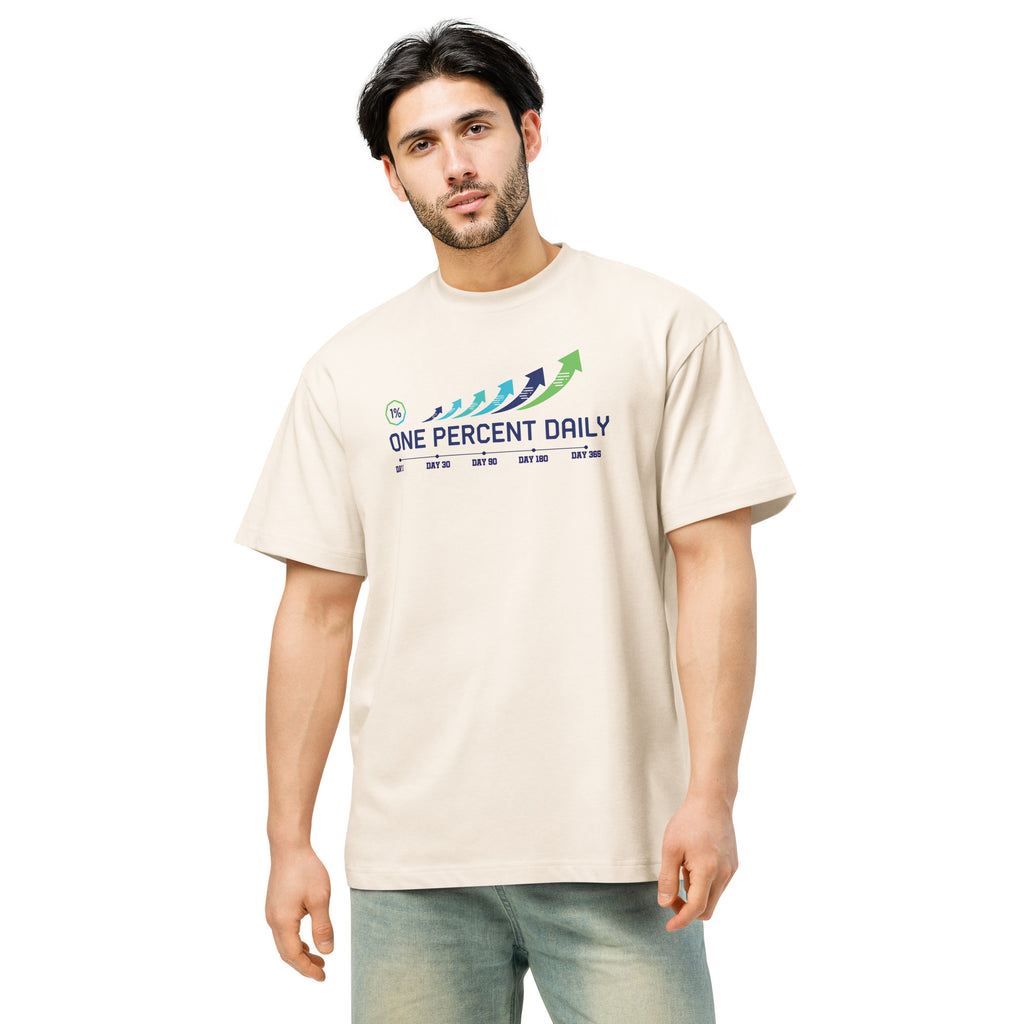 Man wearing a beige t-shirt with 'One Percent Daily' logo on a white background