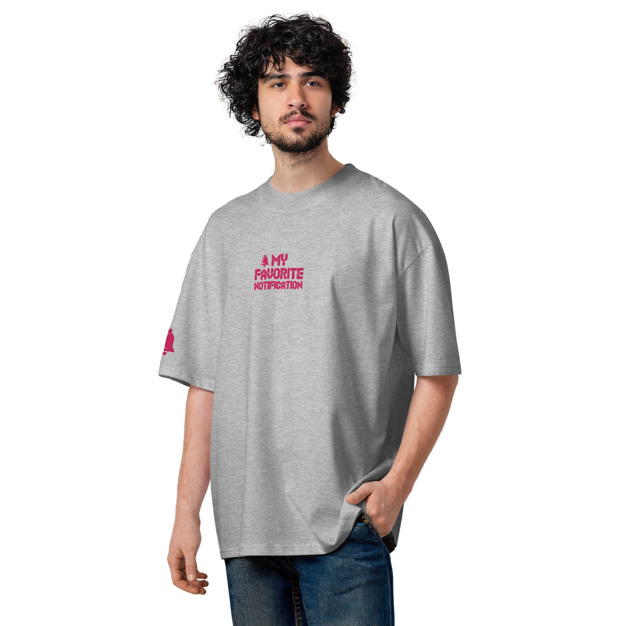 Man wearing a gray t-shirt with pink text on a white background