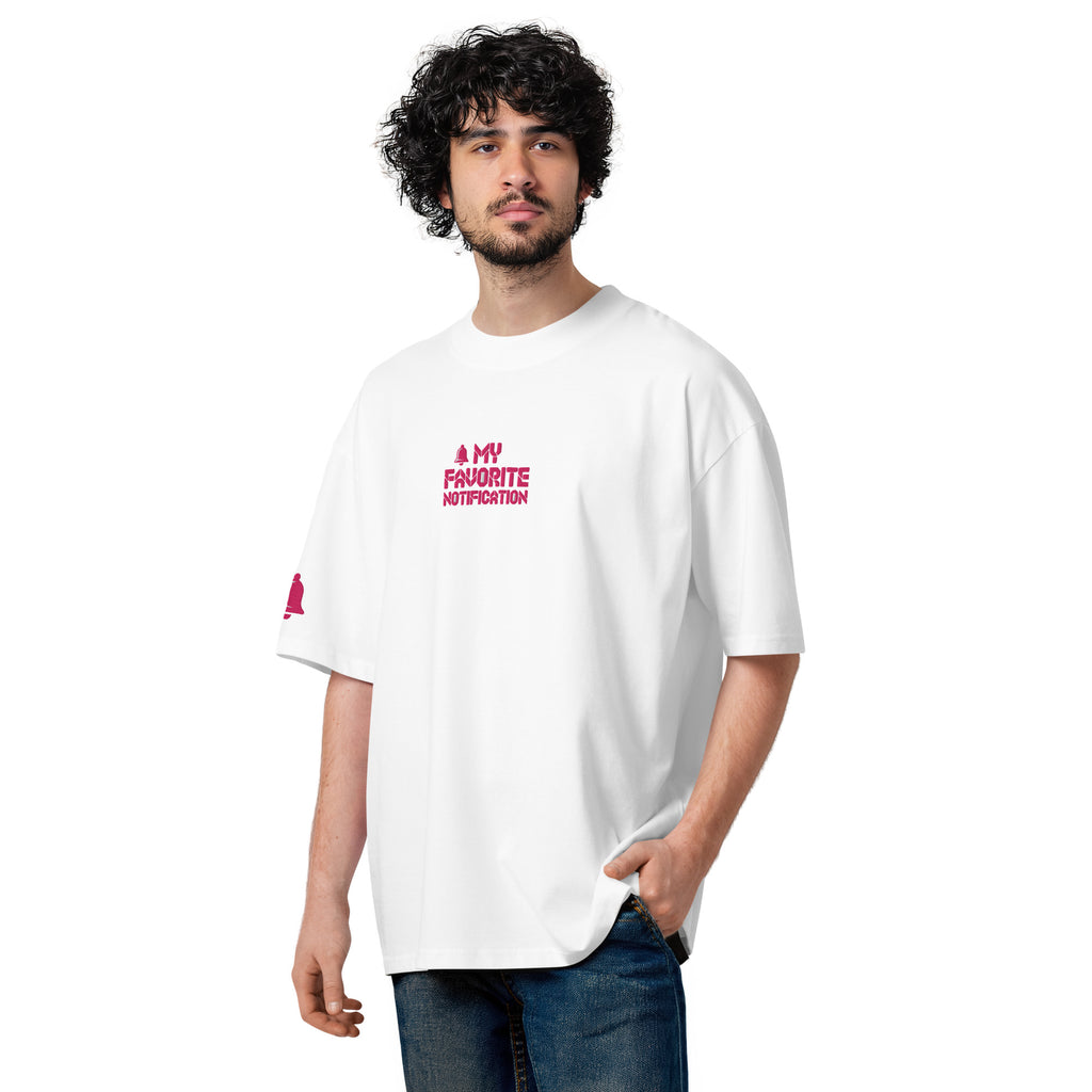 Man wearing a white t-shirt with pink text on a white background