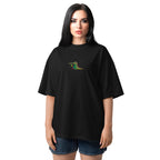 Woman wearing a black t-shirt with a colorful alligator design on a white background