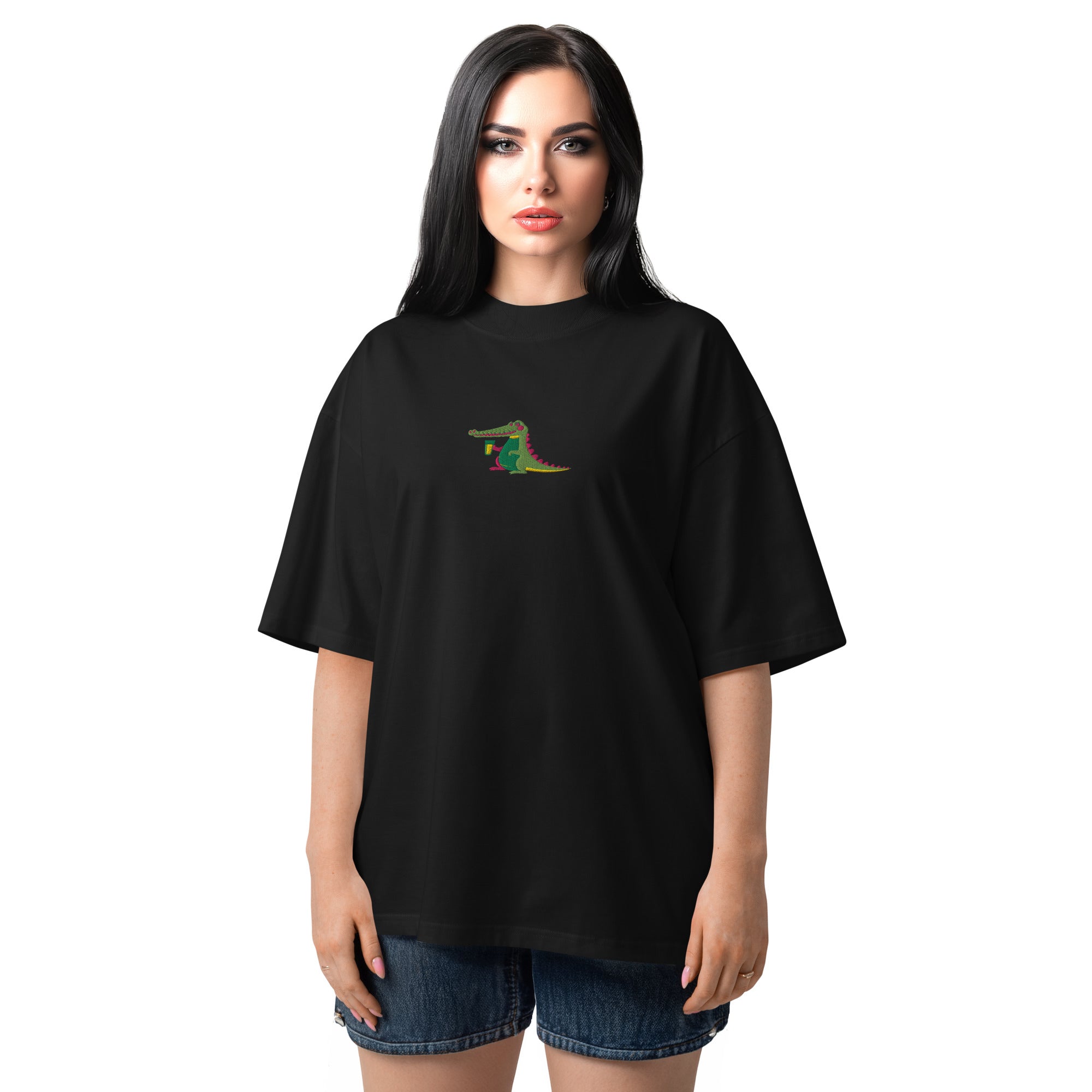 Woman wearing a black t-shirt with a colorful alligator design on a white background