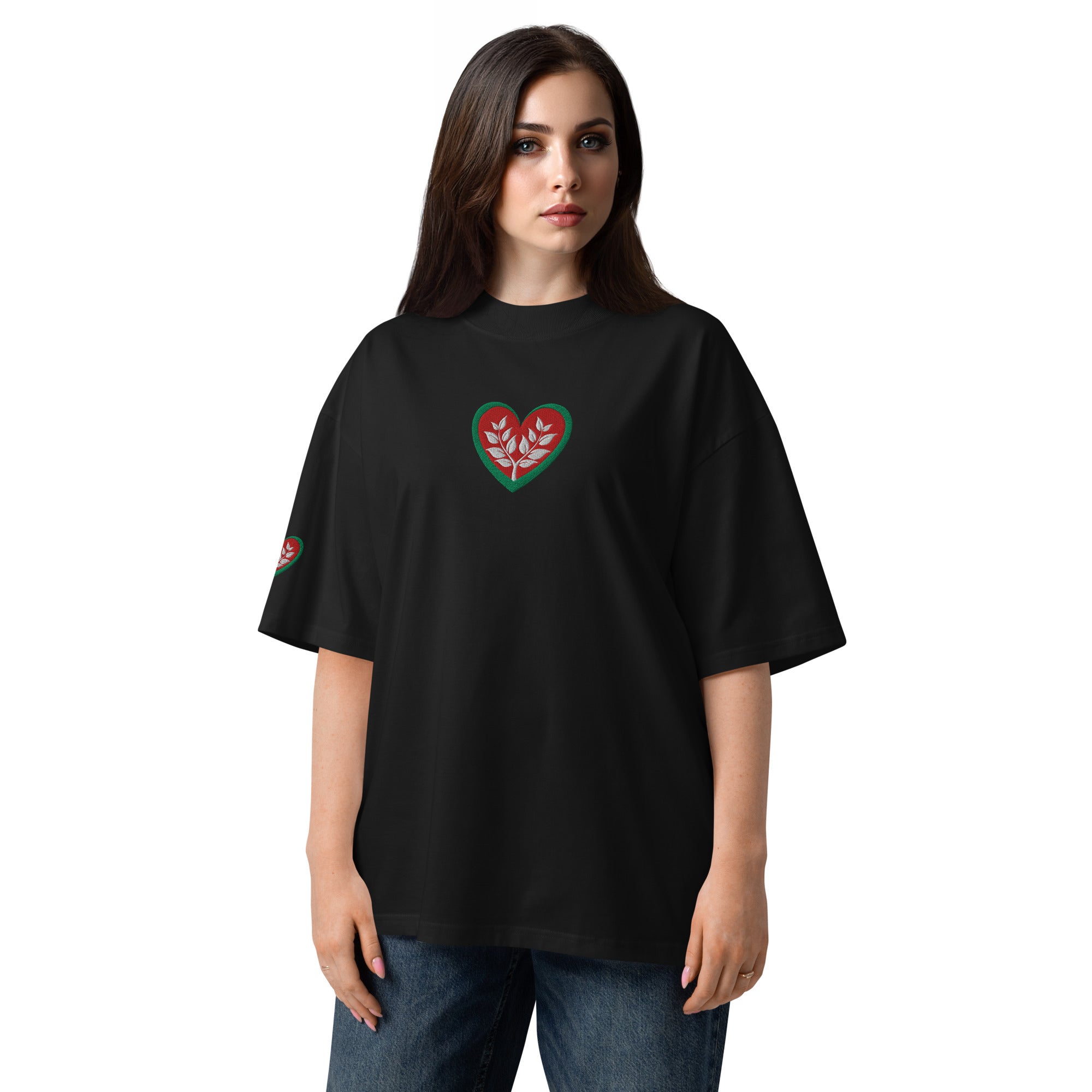 Woman wearing a gray oversized t-shirt with 'LOVE' printed on it against a white background