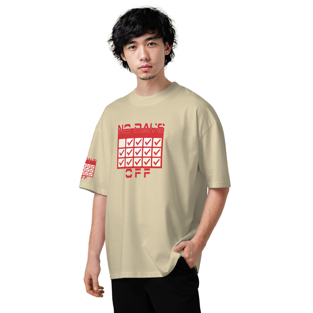 Man wearing a beige t-shirt with red graphic design on a white background