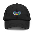 Black cap with a colorful owl design on a white background