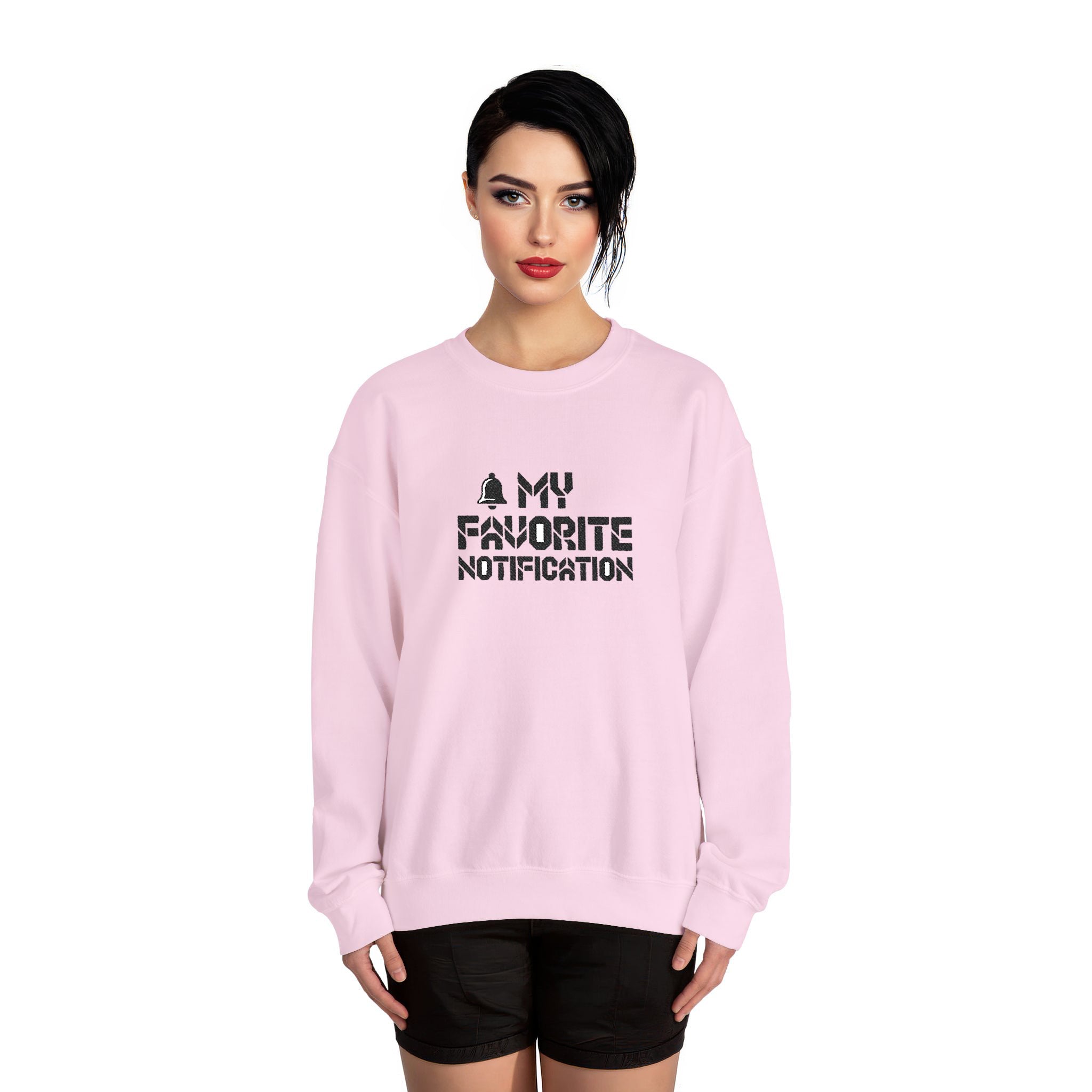 Woman wearing a pink sweatshirt with text design on a white background