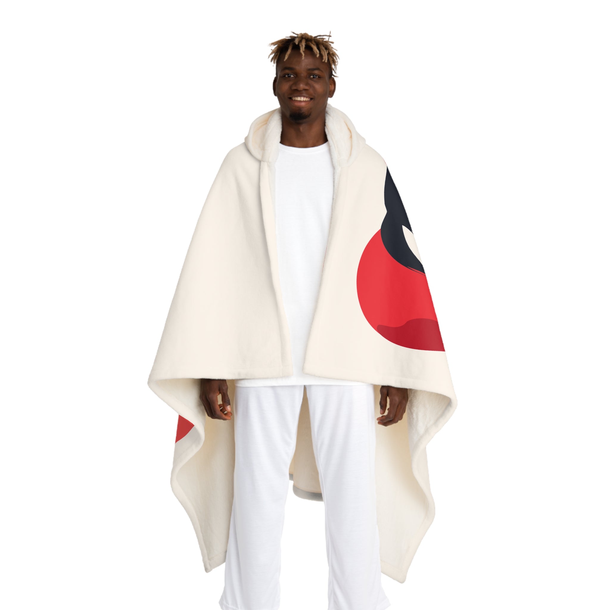 Person wearing a cream-colored cape with red and black design on a white background