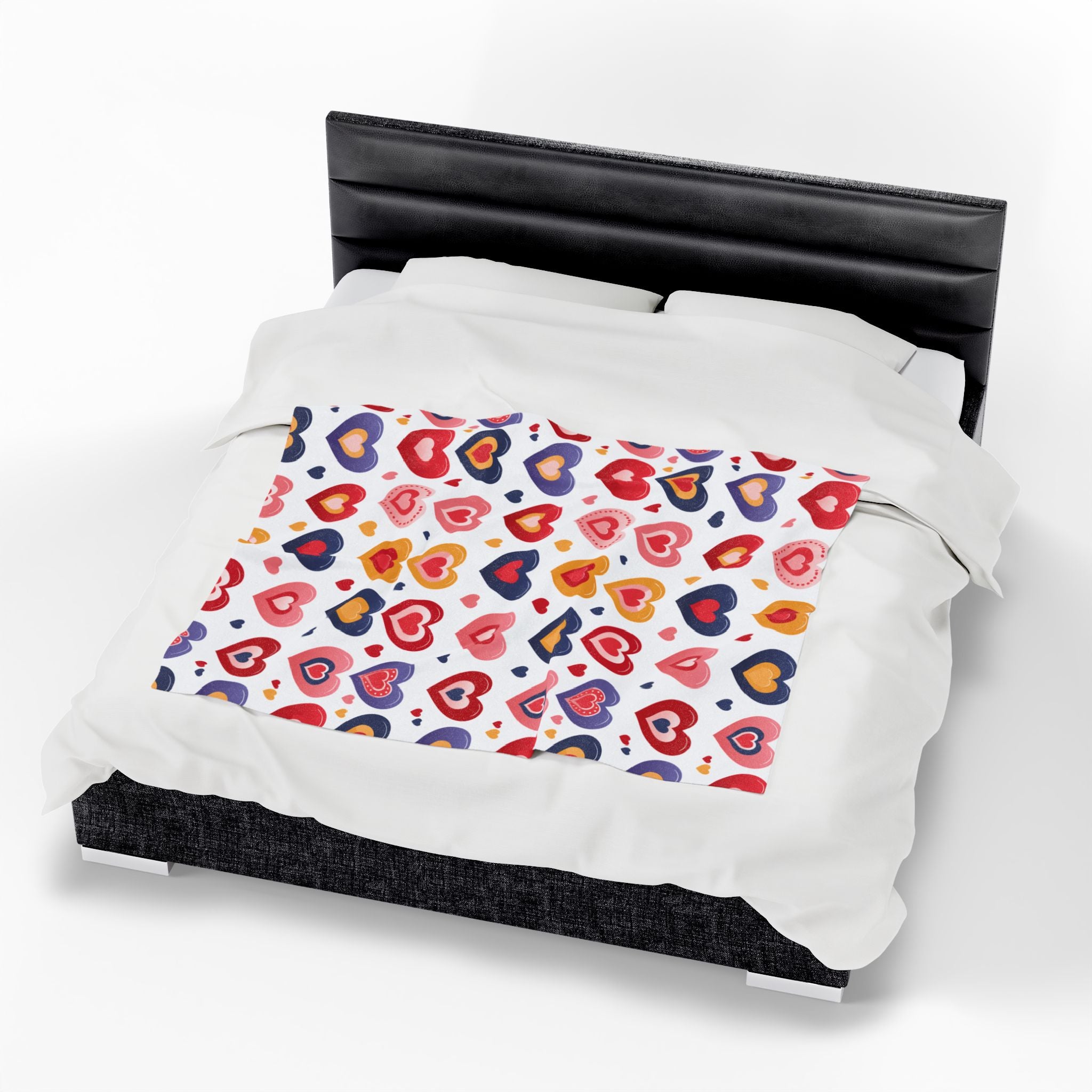 Duvet cover with colorful heart pattern on a bed