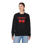 Person wearing a black sweatshirt with 'Cherry Bomb' design on a white background