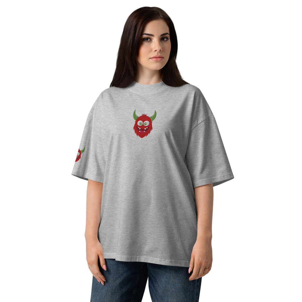 Woman wearing a gray t-shirt with a green and red design on a white background