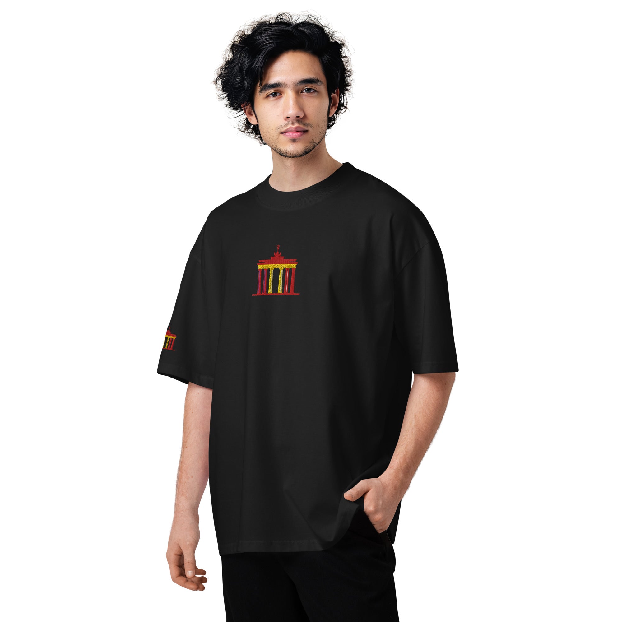 Person wearing a black t-shirt with a colorful graphic design on a white background