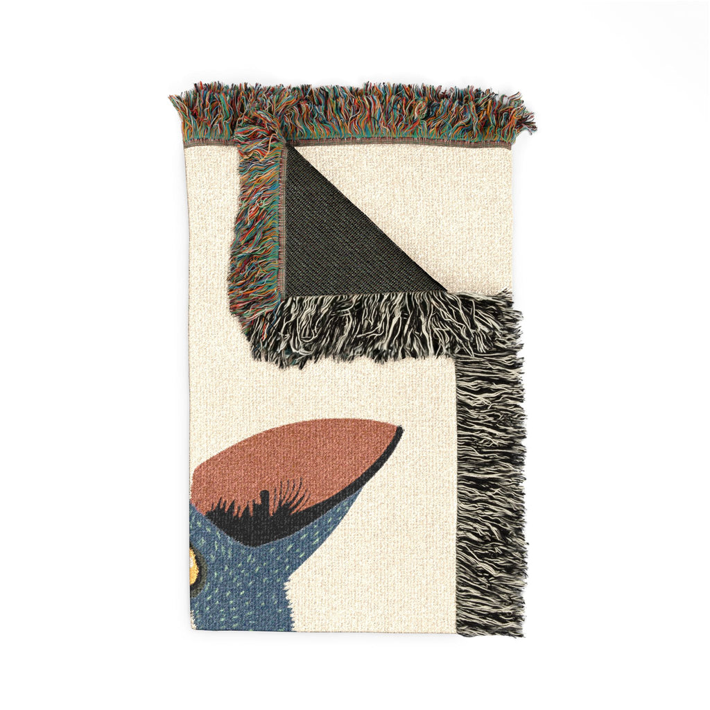 Decorative rug with abstract design and fringed edges on a white background
