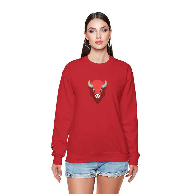 Woman wearing a red sweatshirt with a bull graphic on a white background