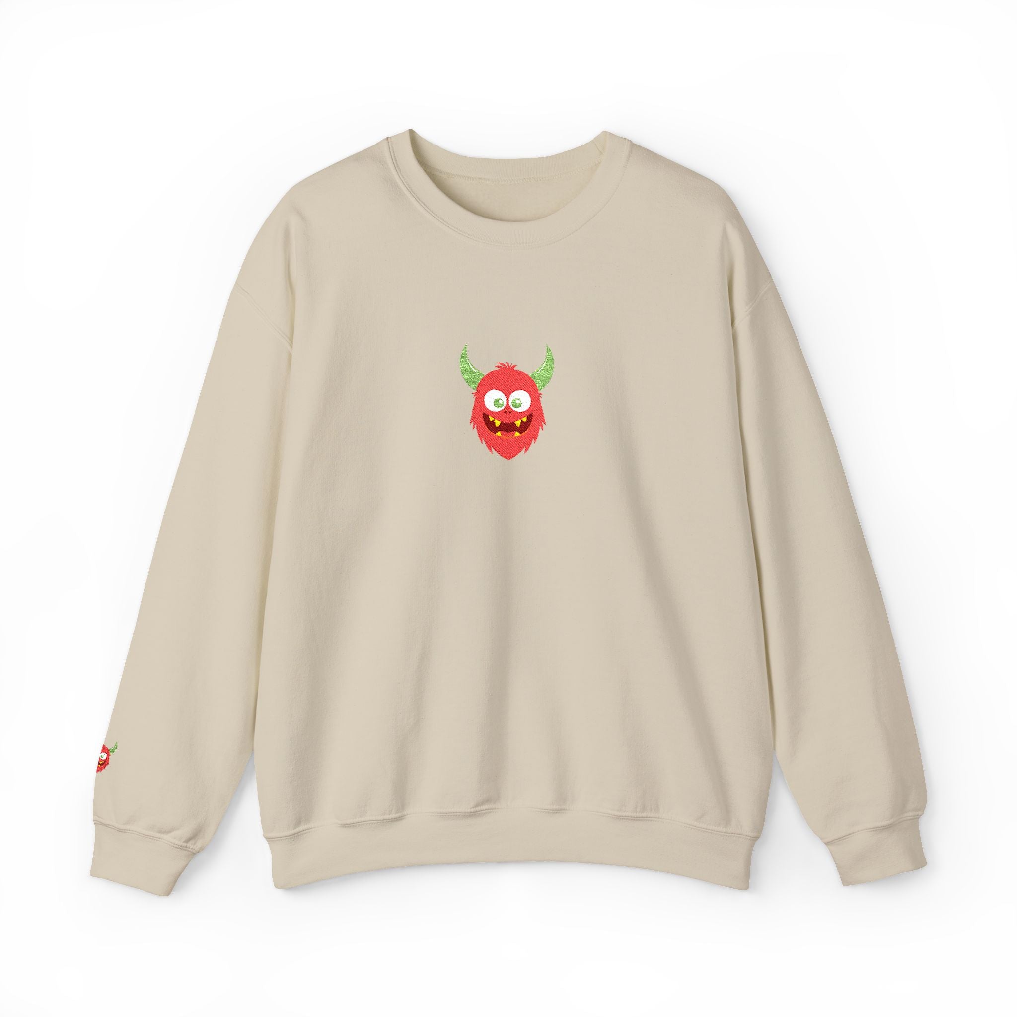 Beige sweatshirt with a red and green monster graphic on a white background