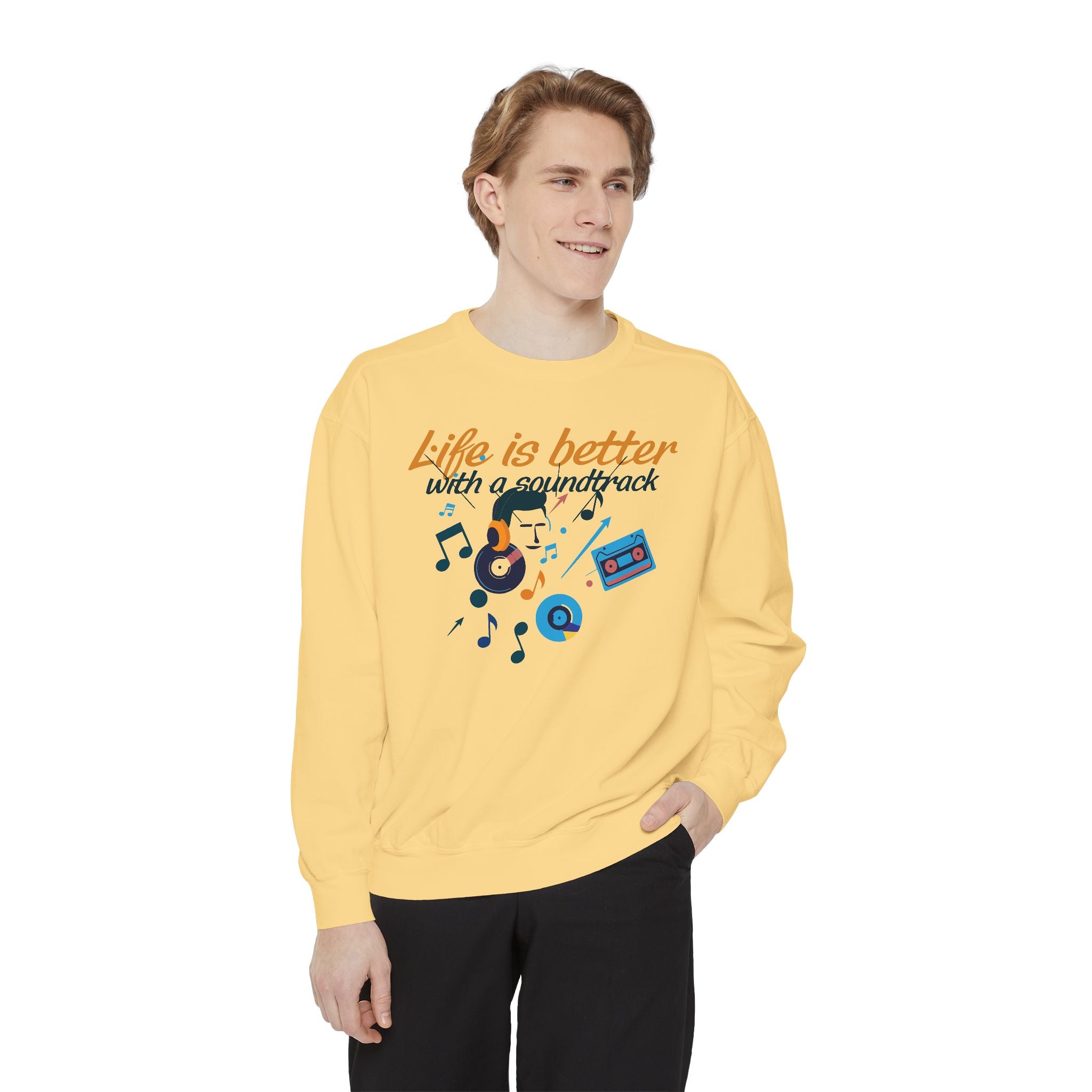 Person wearing a yellow sweatshirt with music-themed design and text on a white background
