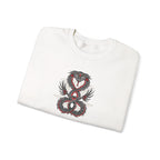 Folded white sweatshirt with a dragon design on a white background