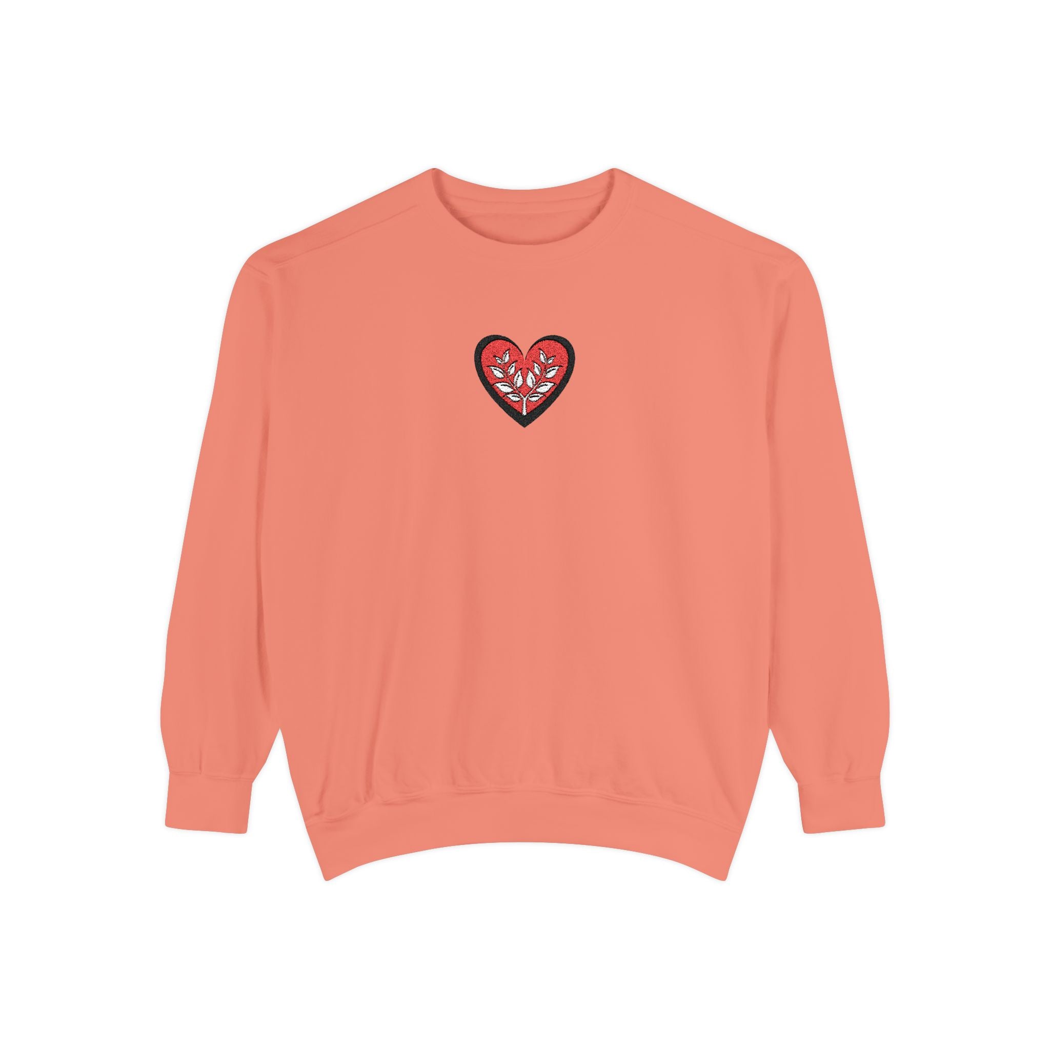 Coral sweatshirt with a heart design on a white background