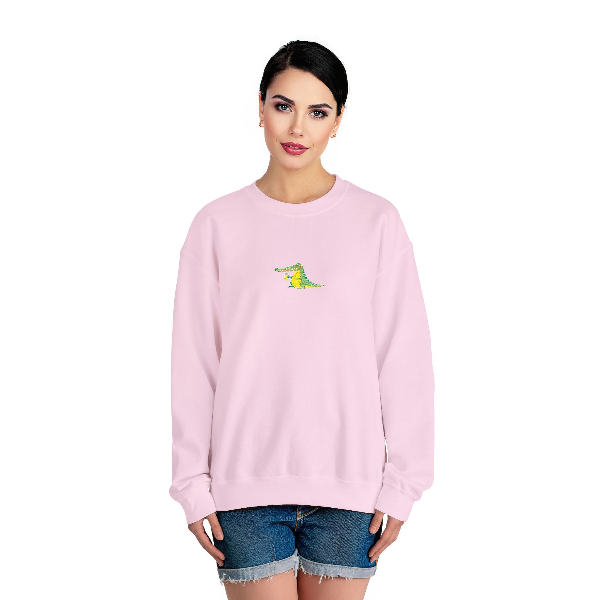 Woman wearing a pink sweatshirt with a small graphic on a white background