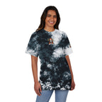 Person wearing a tie-dye t-shirt with a small graphic on a white background