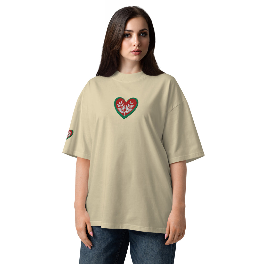 Woman wearing a beige t-shirt with a heart design on a white background