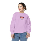 Woman wearing a light purple sweatshirt with a red heart design on a white background