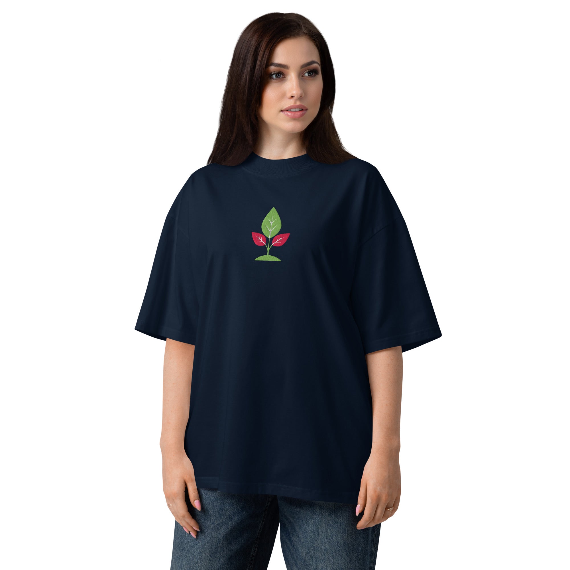 Person wearing a navy blue t-shirt with a green and red logo on a white background