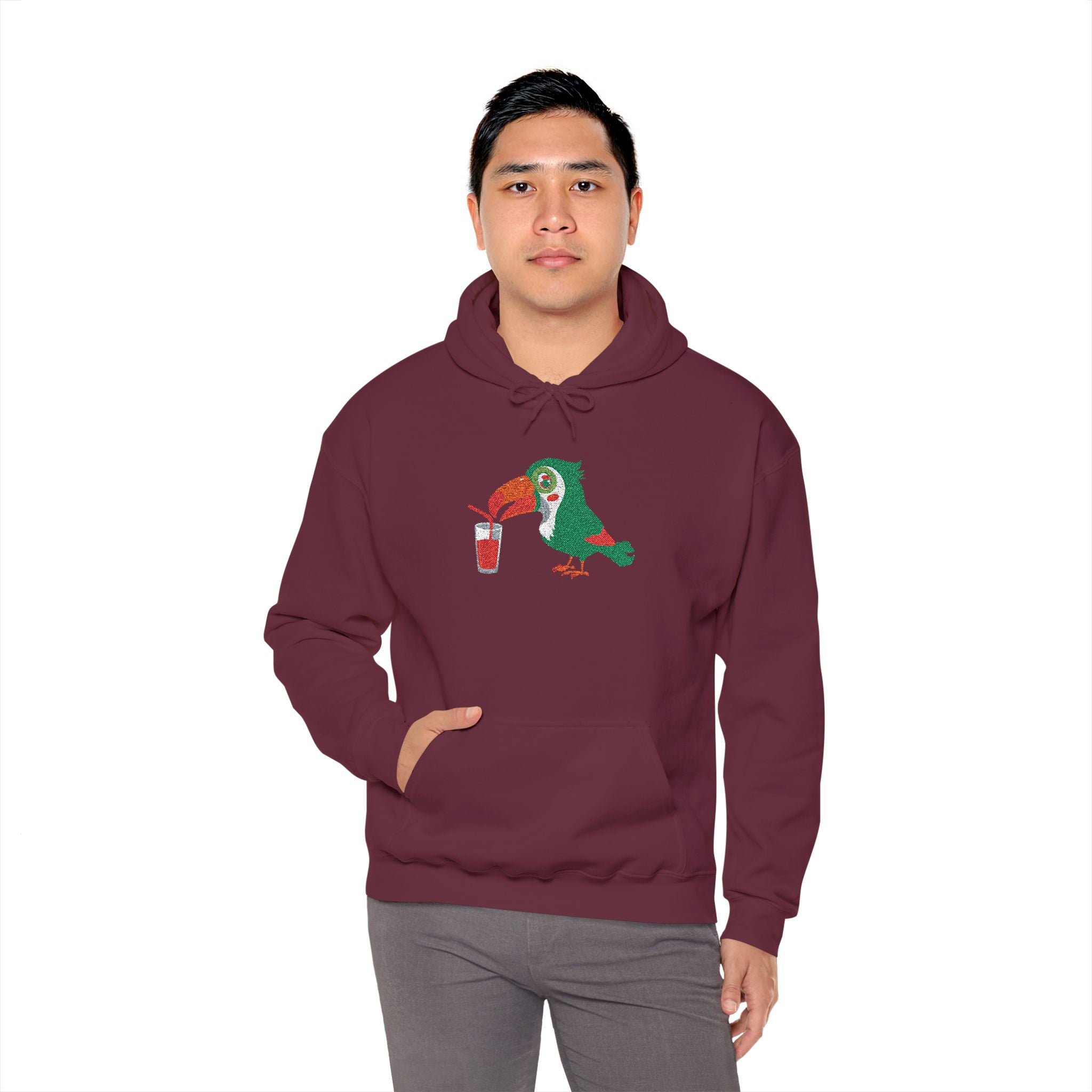 Person wearing a maroon hoodie with a graphic design on a white background