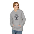 Person wearing a gray hoodie with a tree design on a white background