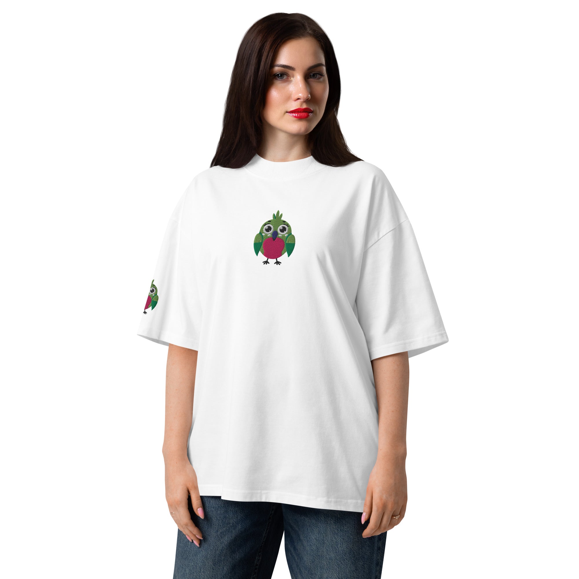 Woman wearing a white t-shirt with cartoon parrot designs on a white background