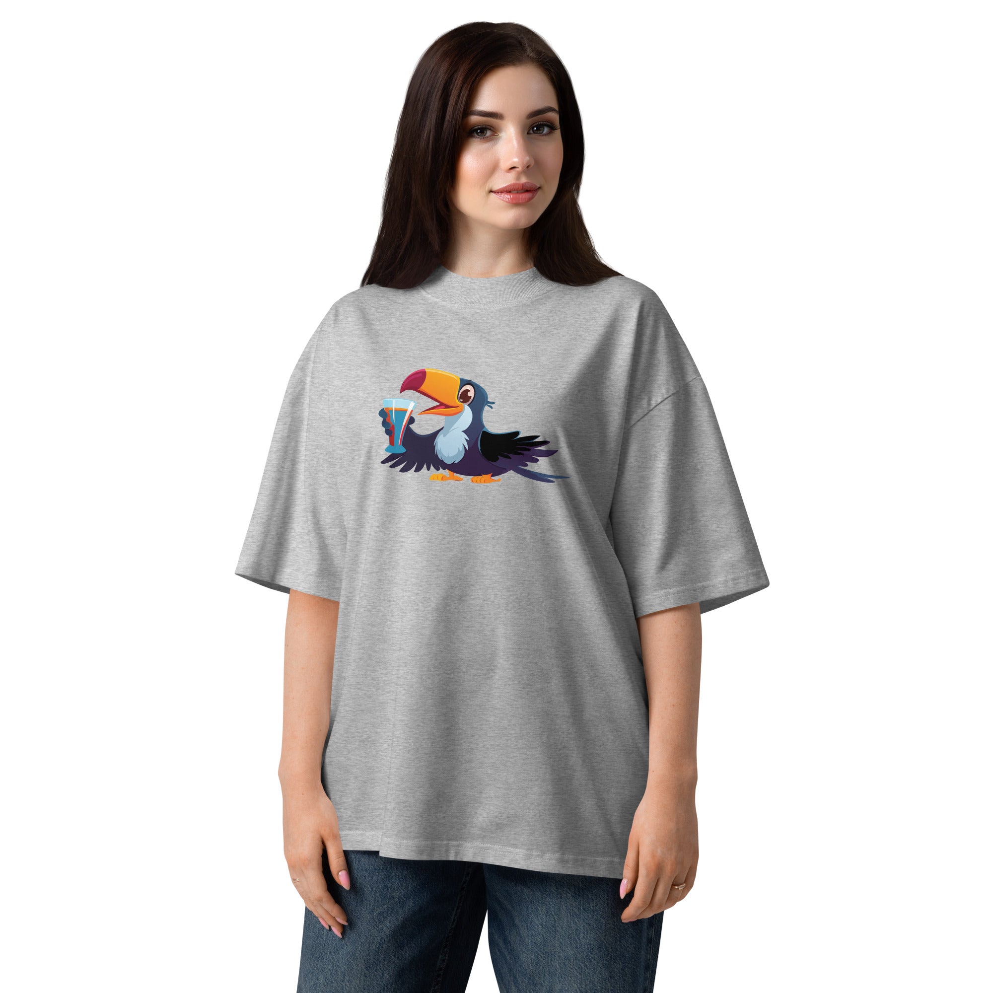 Woman wearing a gray t-shirt with a colorful toucan design on a white background