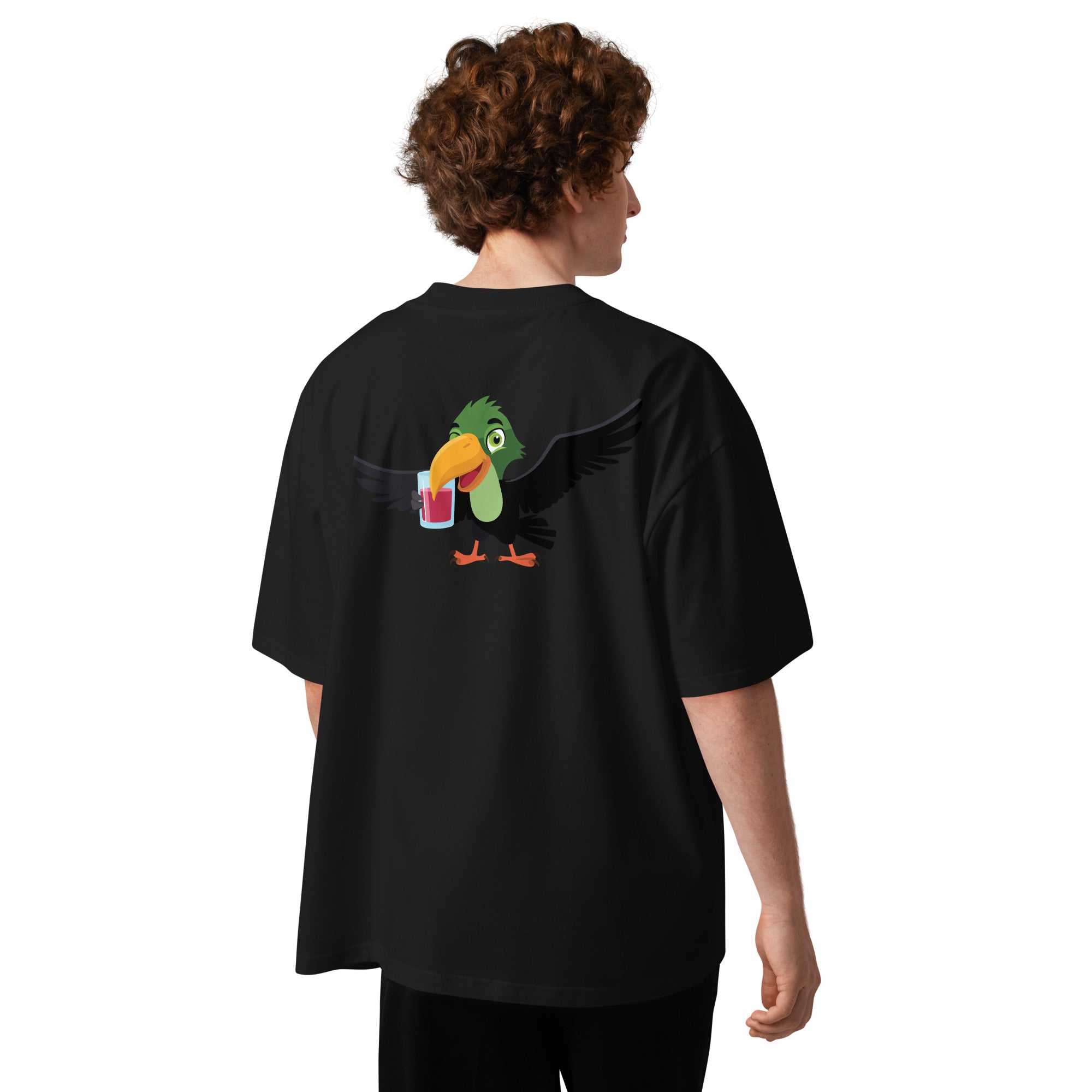 Person wearing a black t-shirt with a colorful parrot design on the back, standing against a white background.